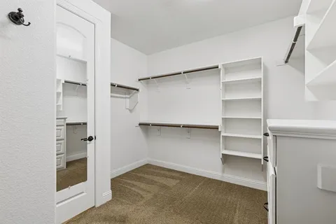 a view of an empty walk in closet