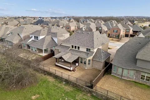 an aerial view of a house with swimming pool and mountain view