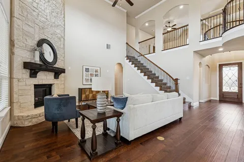 a living room with furniture and a fireplace