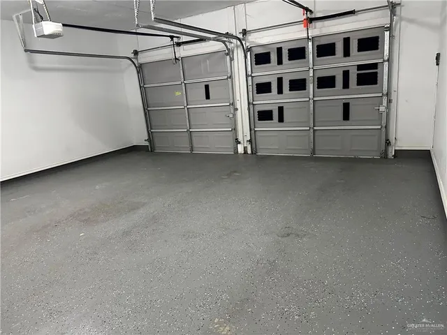 an empty room with wooden floor chandelier fan and closet area