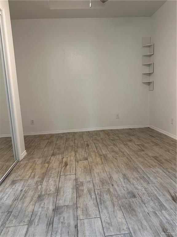 905 Colorado Court Mission, TX 78572 - Photo 15 of 42 a view of room with wooden floor
