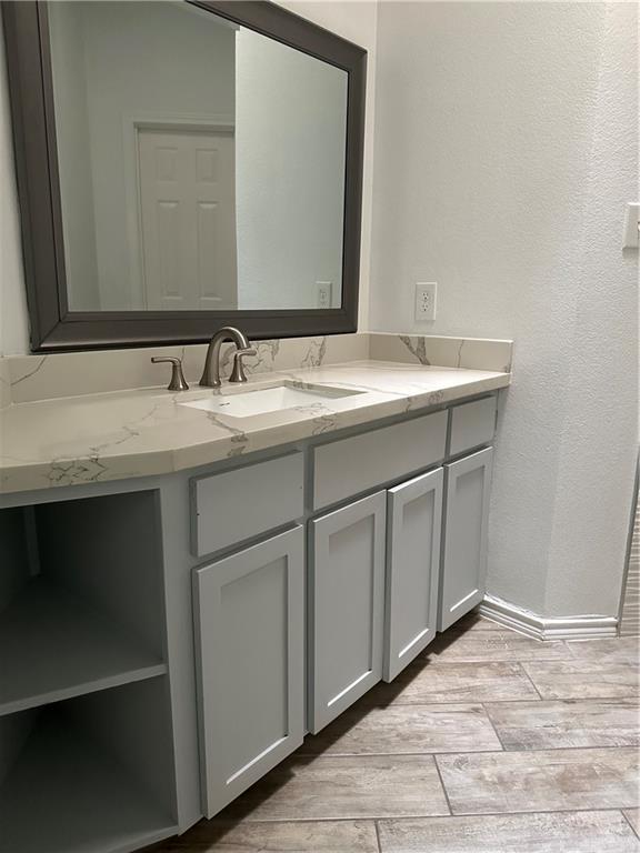 905 Colorado Court Mission, TX 78572 - Photo 20 of 42 a bathroom with a sink and a mirror