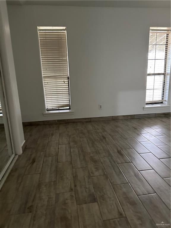 905 Colorado Court Mission, TX 78572 - Photo 21 of 42 an empty room with wooden floor and windows