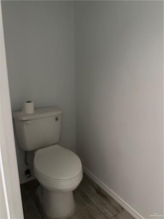 905 Colorado Court Mission, TX 78572 - Photo 23 of 42 a white toilet sitting next to a white wall