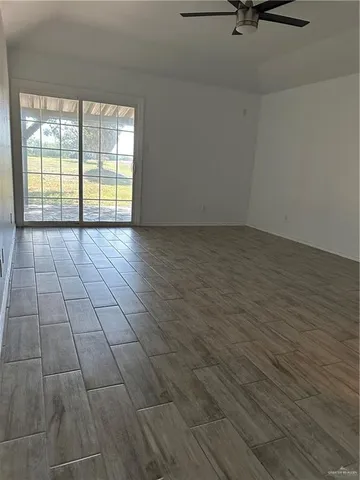a view of a kitchen with a sink and cabinets