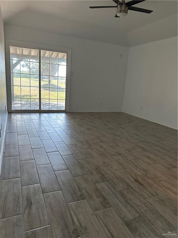 905 Colorado Court Mission, TX 78572 - Photo 31 of 42 wooden floor in an empty room with a window