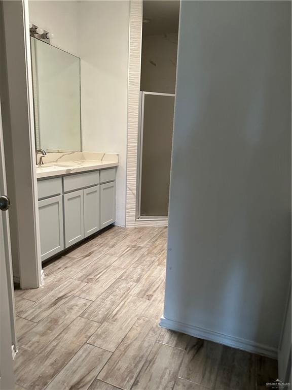 905 Colorado Court Mission, TX 78572 - Photo 32 of 42 a bathroom with a sink and a mirror