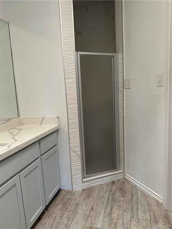 905 Colorado Court Mission, TX 78572 - Photo 33 of 42 a bathroom with a sink and mirror
