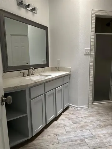 a bathroom with a sink and a mirror
