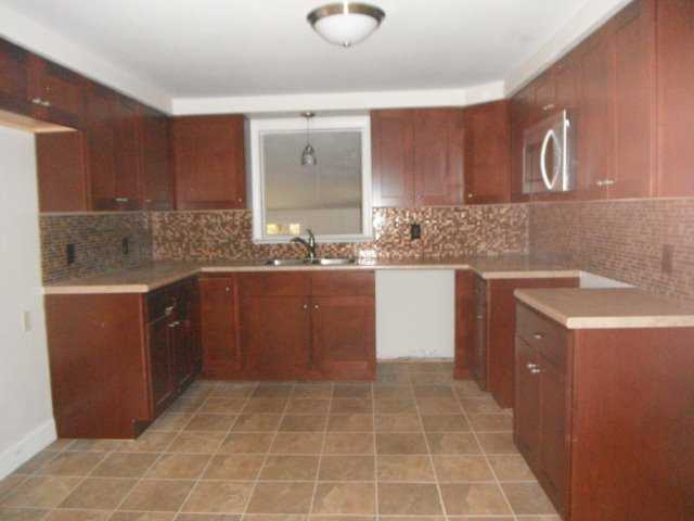 282 Knotty Oak Road Coventry, RI 02816 - Photo 2 of 16 Kitchen. Brand new kitchen cabinets countertops flooring sink microwave and tile flooring
