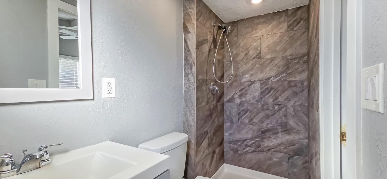 206 West 20th Street Tracy, CA 95376 - Photo 15 of 20 a bathroom with a toilet and a sink