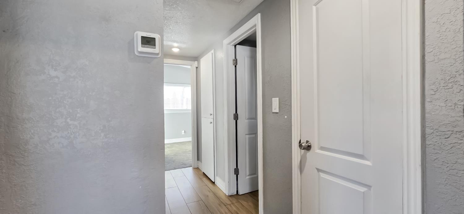 206 West 20th Street Tracy, CA 95376 - Photo 8 of 20 a view of a hallway with wooden floor