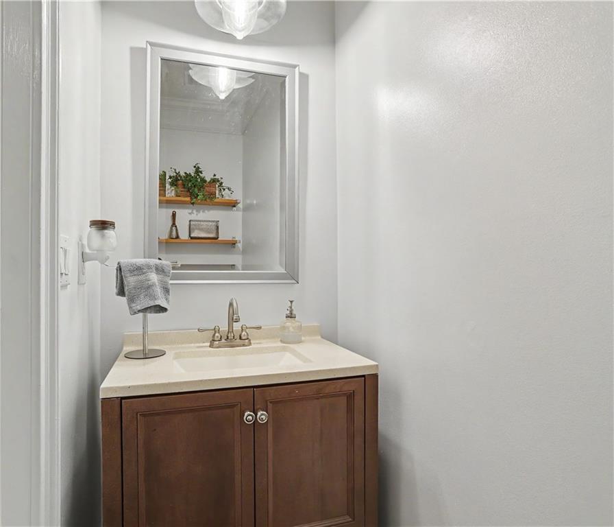 537 Old Collins Road Hoschton, GA 30548 - Photo 27 of 42 a bathroom with a sink and a mirror