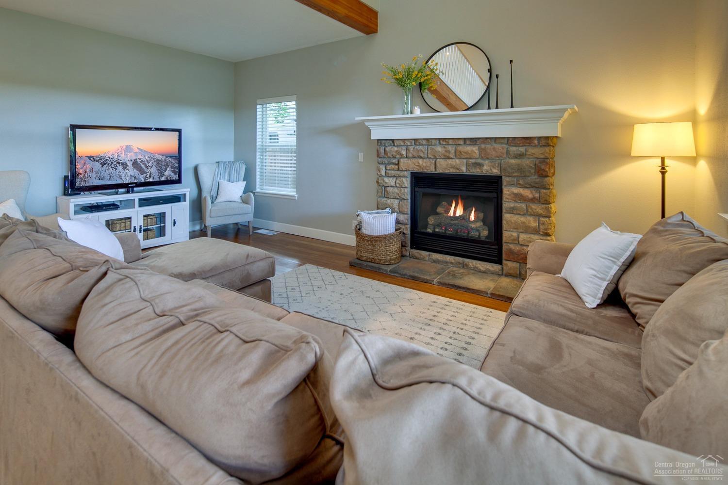 61197 Ridgewater Loop Bend, OR 97702 - Photo 6 of 25 Cozy up to this stone framed gas firepla