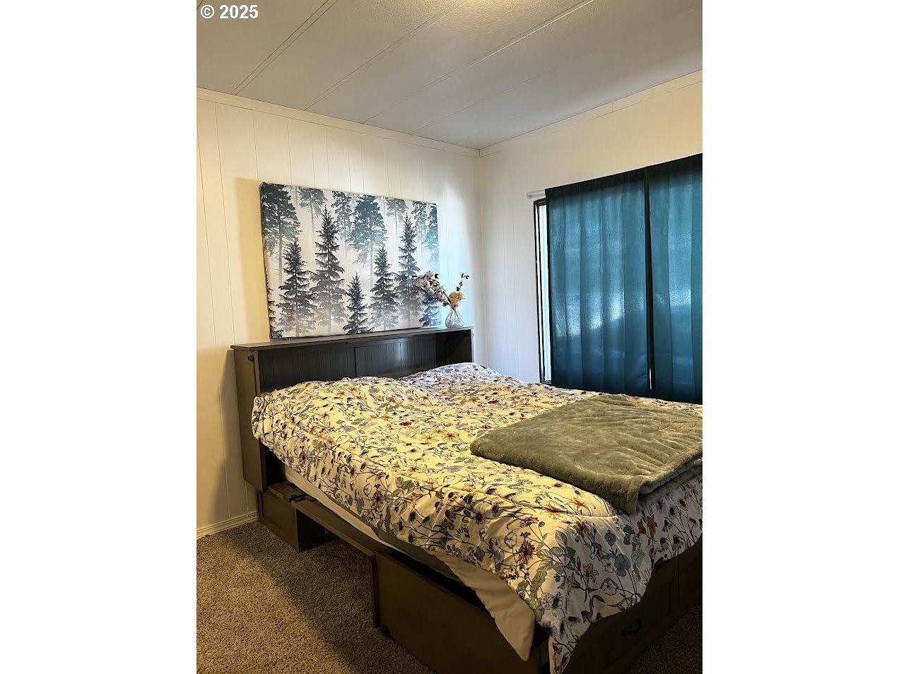 1255 Southwest Sandy Drive Hermiston, OR 97838 - Photo 11 of 16 a bed sitting in a bedroom next to a window