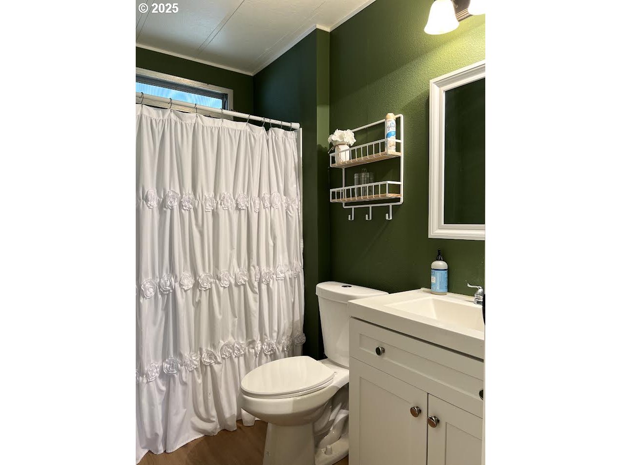 1255 Southwest Sandy Drive Hermiston, OR 97838 - Photo 13 of 16 a white toilet sitting next to a bathroom sink