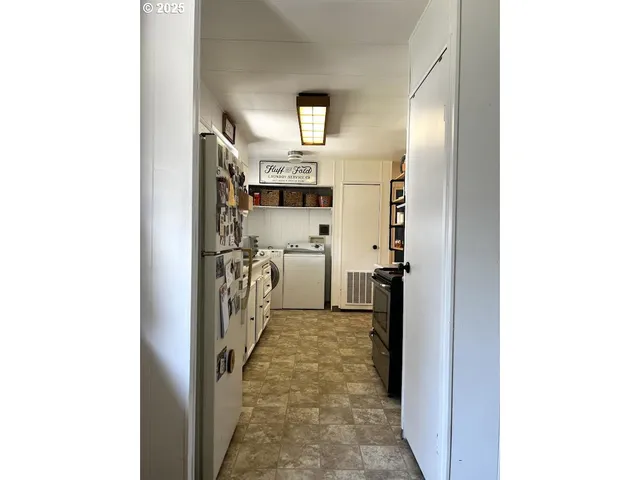 a view of a hallway with a white walls