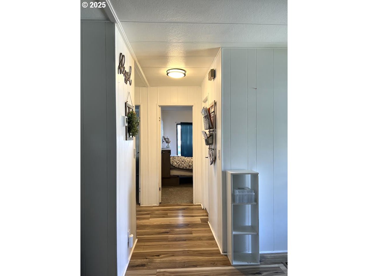 1255 Southwest Sandy Drive Hermiston, OR 97838 - Photo 10 of 16 a view of a hallway with wooden floor and a large mirror