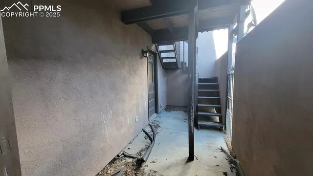 a view of a house with a wooden deck