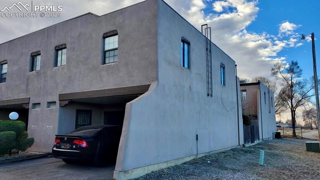 1925 Mohawk Road Pueblo, CO 81001 - Photo 2 of 13 a living room with furniture and a chandelier