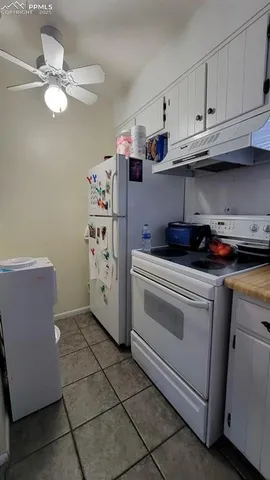 a kitchen with appliances cabinets and a sink