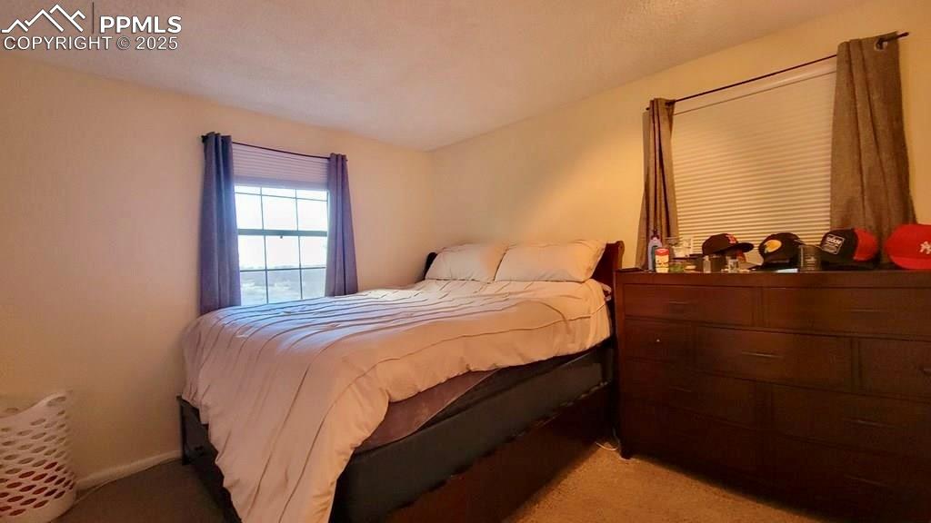 1925 Mohawk Road Pueblo, CO 81001 - Photo 6 of 13 a bedroom with a bed and a window