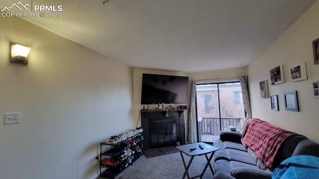 1925 Mohawk Road Pueblo, CO 81001 - Photo 10 of 13 a living room with furniture and a flat screen tv