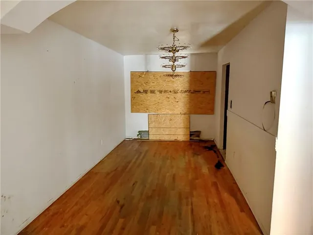 a kitchen with kitchen island a counter top space cabinets and a chair
