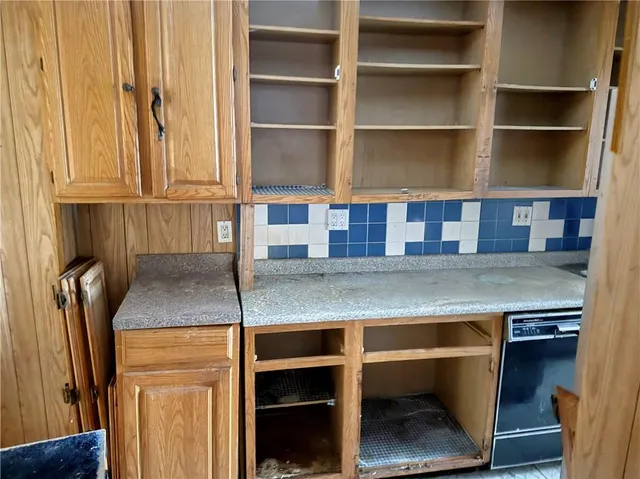 a view of storage and utility room with a window