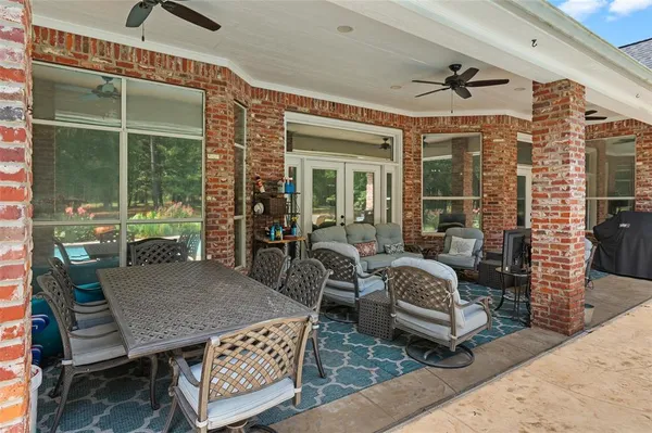 a view of a livingroom with furniture and a table wooden floor