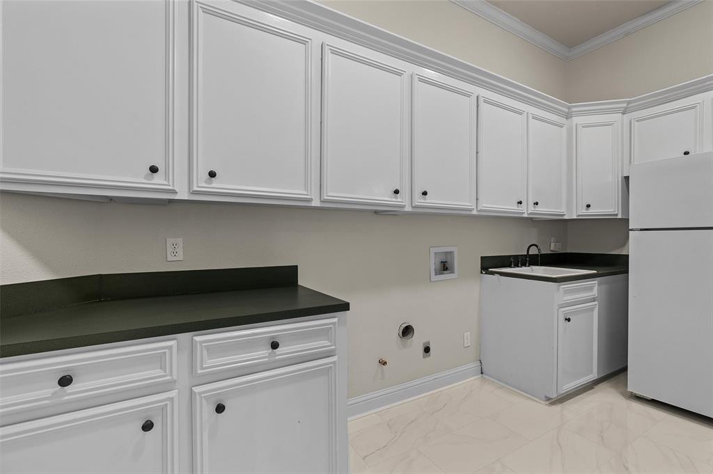 2584 Butler Hill Road Benton, LA 71006 - Photo 28 of 33 a kitchen with white cabinets and a stove