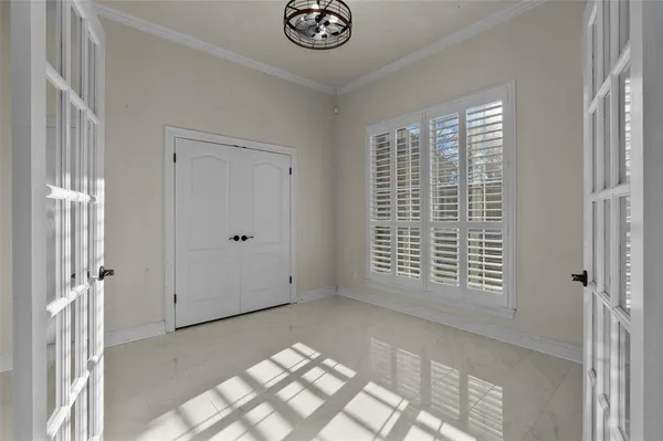 a view of an empty room with windows