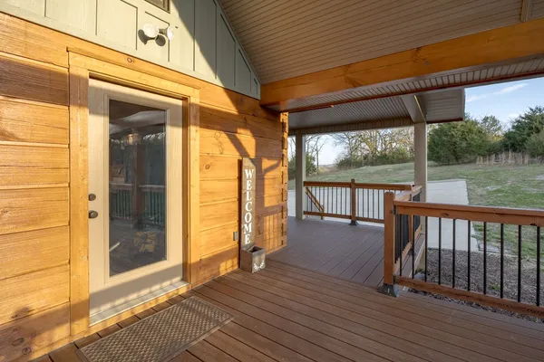 a kitchen with stainless steel appliances granite countertop a kitchen island hardwood floor and a sink