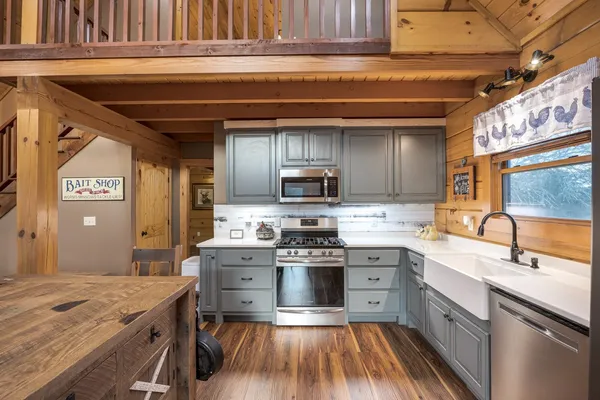 a view of a house with a yard and garage