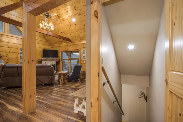 a view of a dry yard with wooden fence