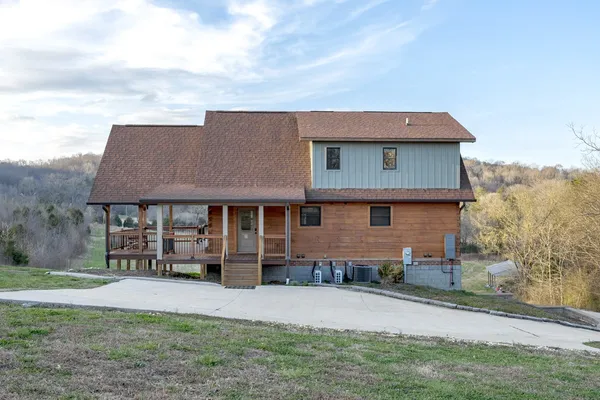 a view of a porch with wooden floor and outdoor space