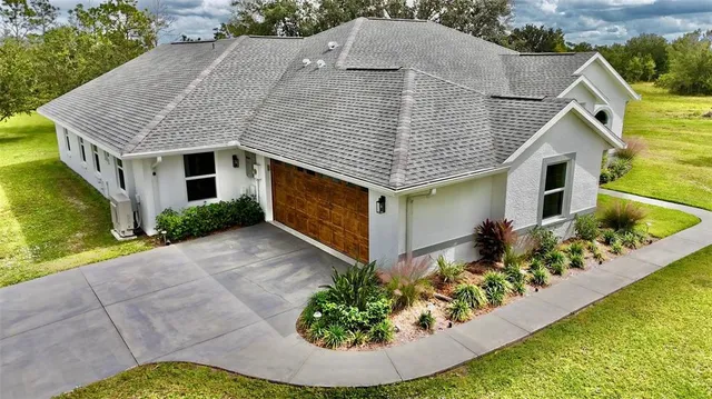 a view of a garage with a car parked in it