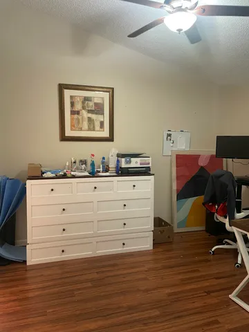 a room with couch and a dresser
