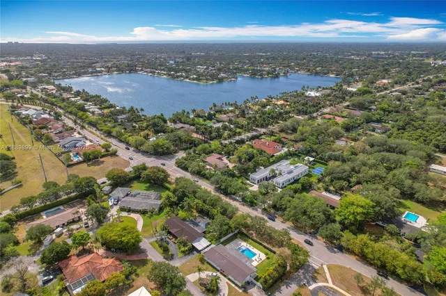 an aerial view of residential building with green space