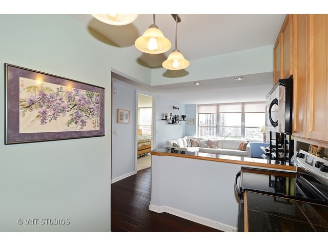 655 West Irving Park Road, Unit 1707 Chicago, IL 60613 - Photo 6 of 14 a kitchen with a sink cabinets and window