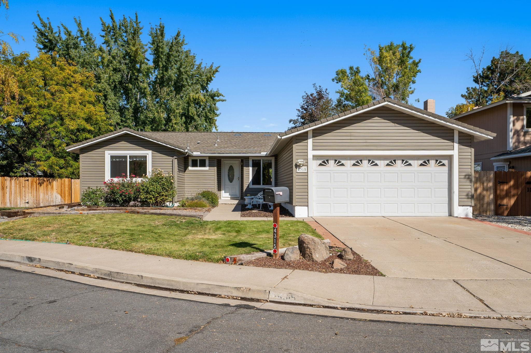 a front view of a house with a yard and porch