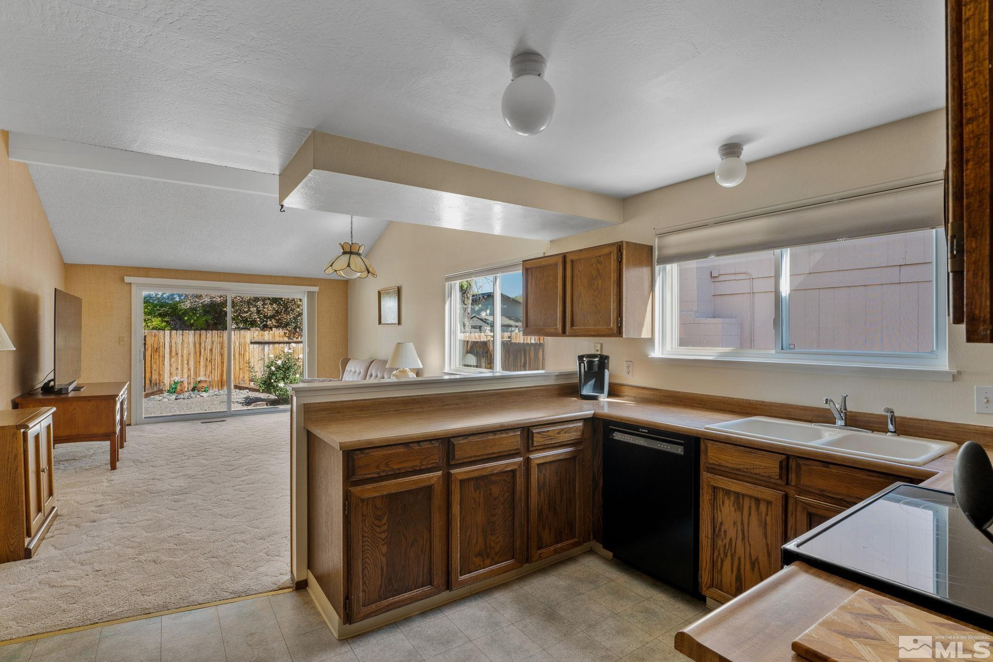 4315 Mendocino Lane Reno, NV 89502 - Photo 17 of 31 a kitchen with a sink stove and cabinets