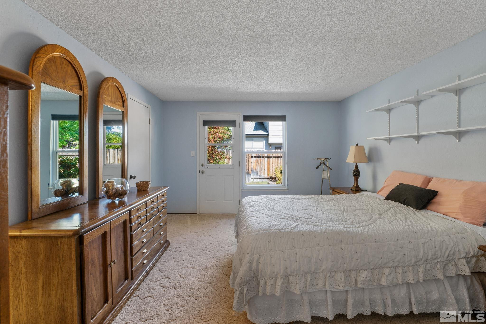 4315 Mendocino Lane Reno, NV 89502 - Photo 18 of 31 a bedroom with a bed and a large window