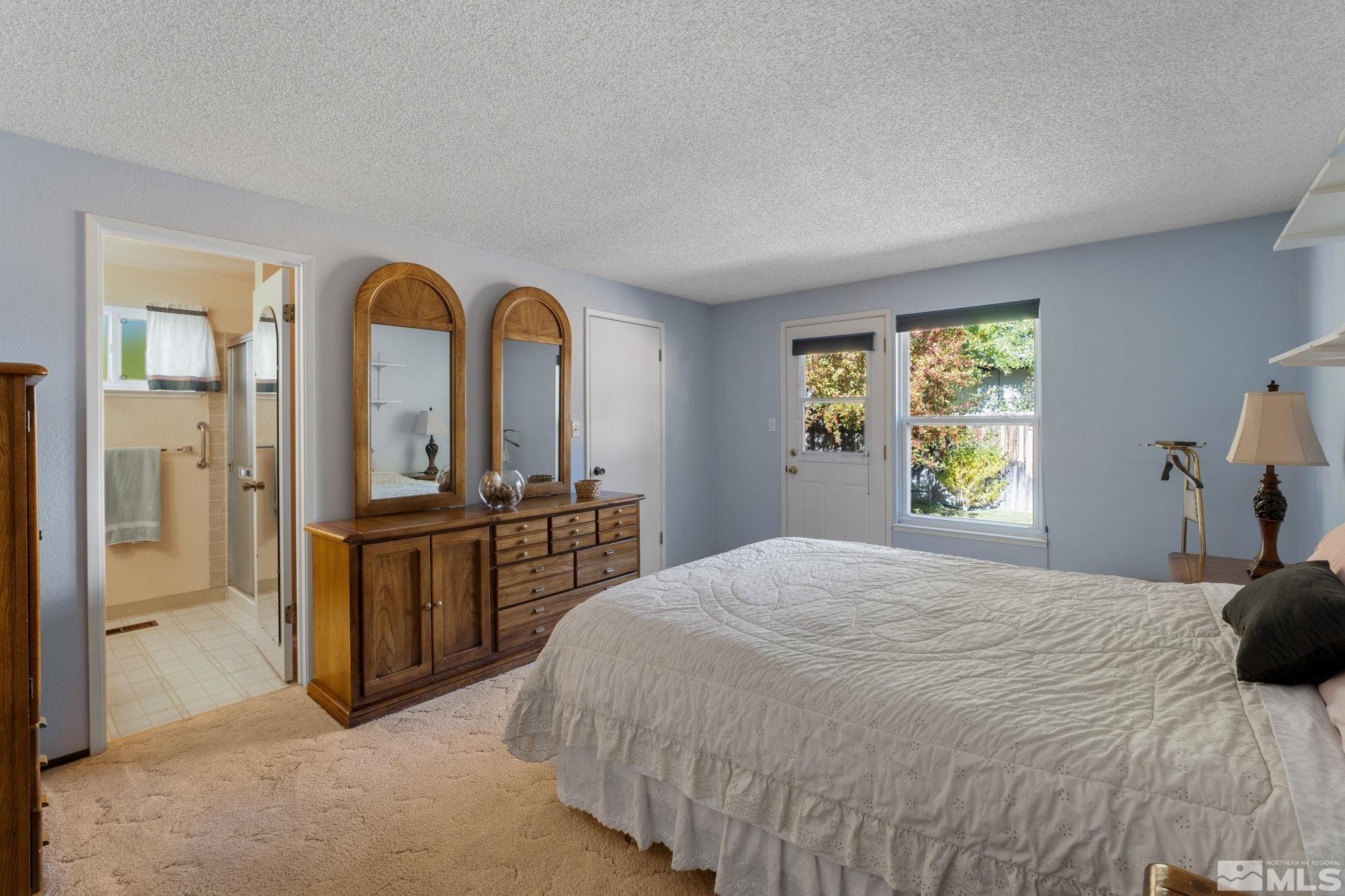 4315 Mendocino Lane Reno, NV 89502 - Photo 19 of 31 a bedroom with a bed and a dresser