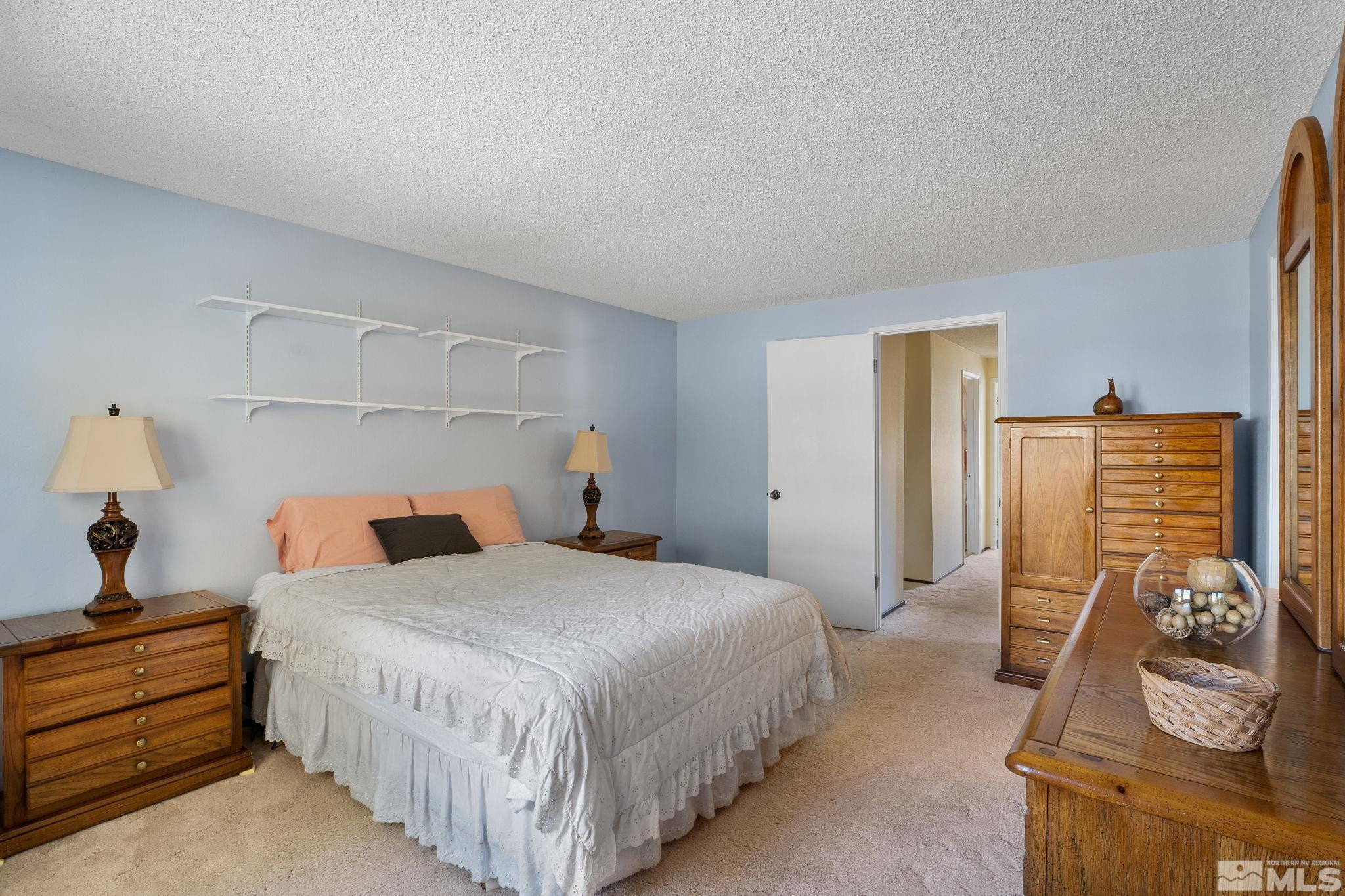 4315 Mendocino Lane Reno, NV 89502 - Photo 20 of 31 a bedroom with a bed and wooden floor