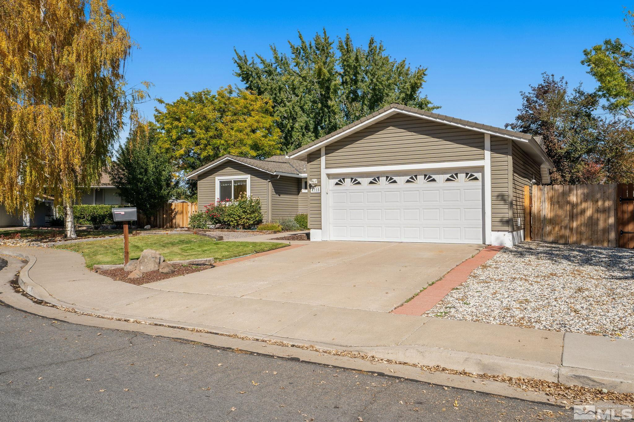 4315 Mendocino Lane Reno, NV 89502 - Photo 2 of 31 a view of a house with a yard and large tree