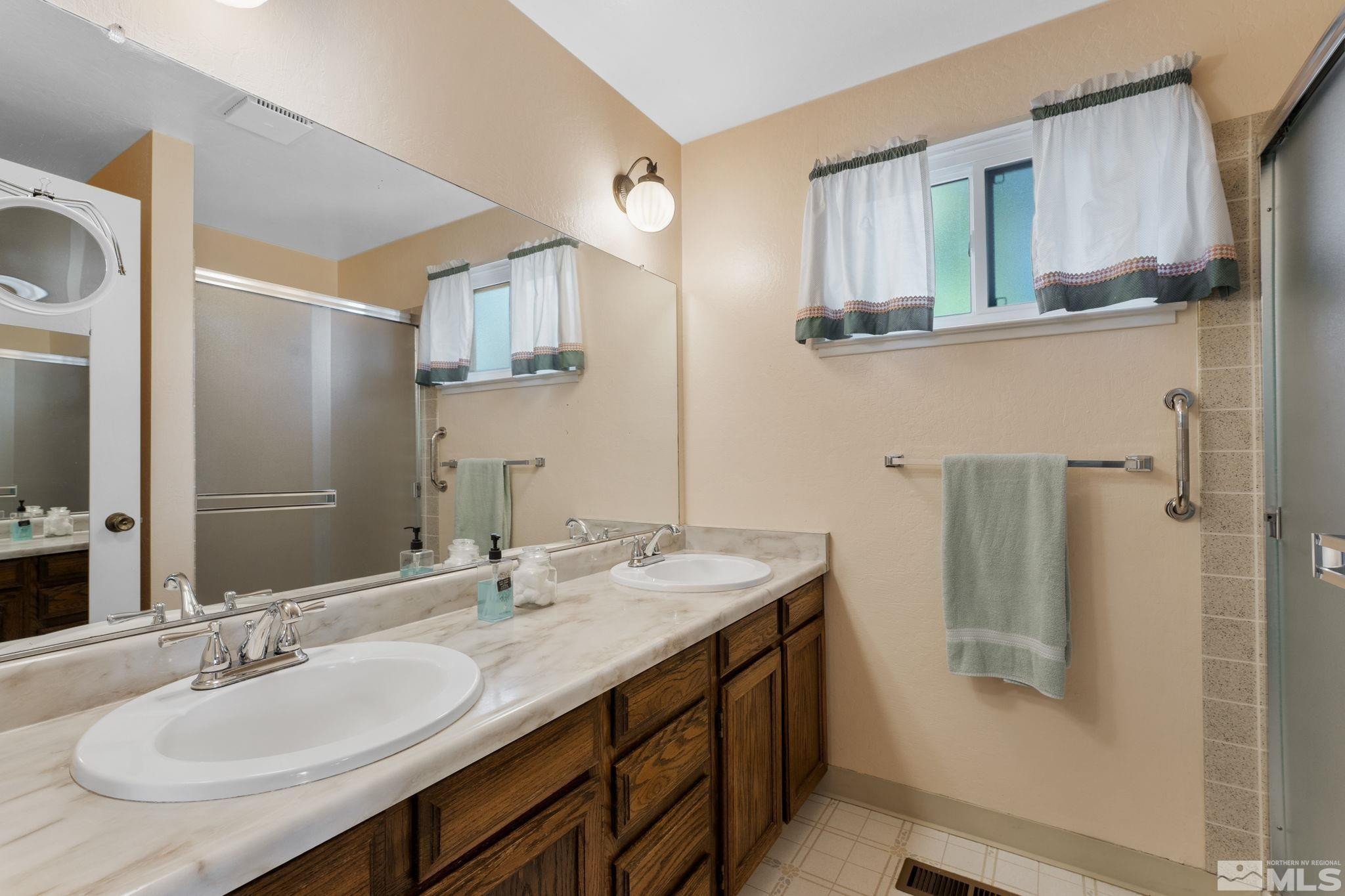 4315 Mendocino Lane Reno, NV 89502 - Photo 21 of 31 a bathroom with a granite countertop sink mirror and double