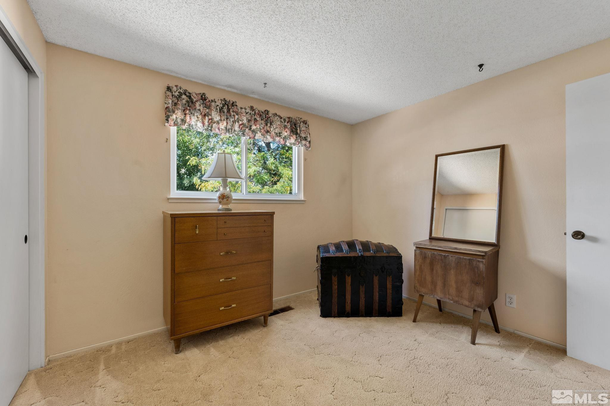 4315 Mendocino Lane Reno, NV 89502 - Photo 23 of 31 a room with a dresser and a window