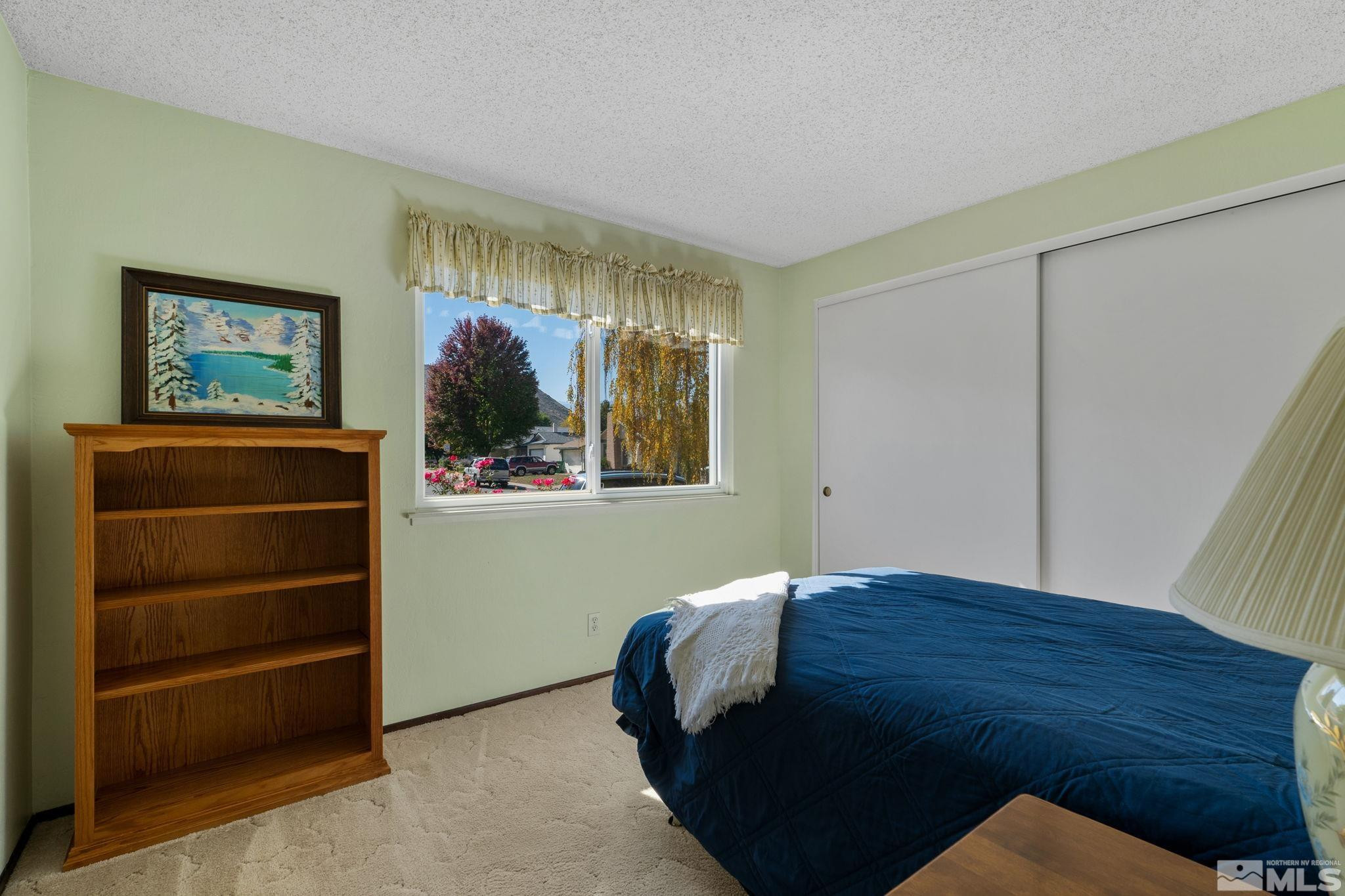 4315 Mendocino Lane Reno, NV 89502 - Photo 25 of 31 a bedroom with a bed and a window