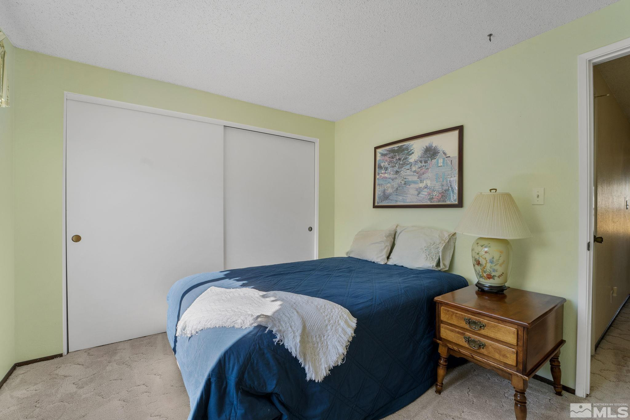 4315 Mendocino Lane Reno, NV 89502 - Photo 26 of 31 a bedroom with a bed and a cabinets